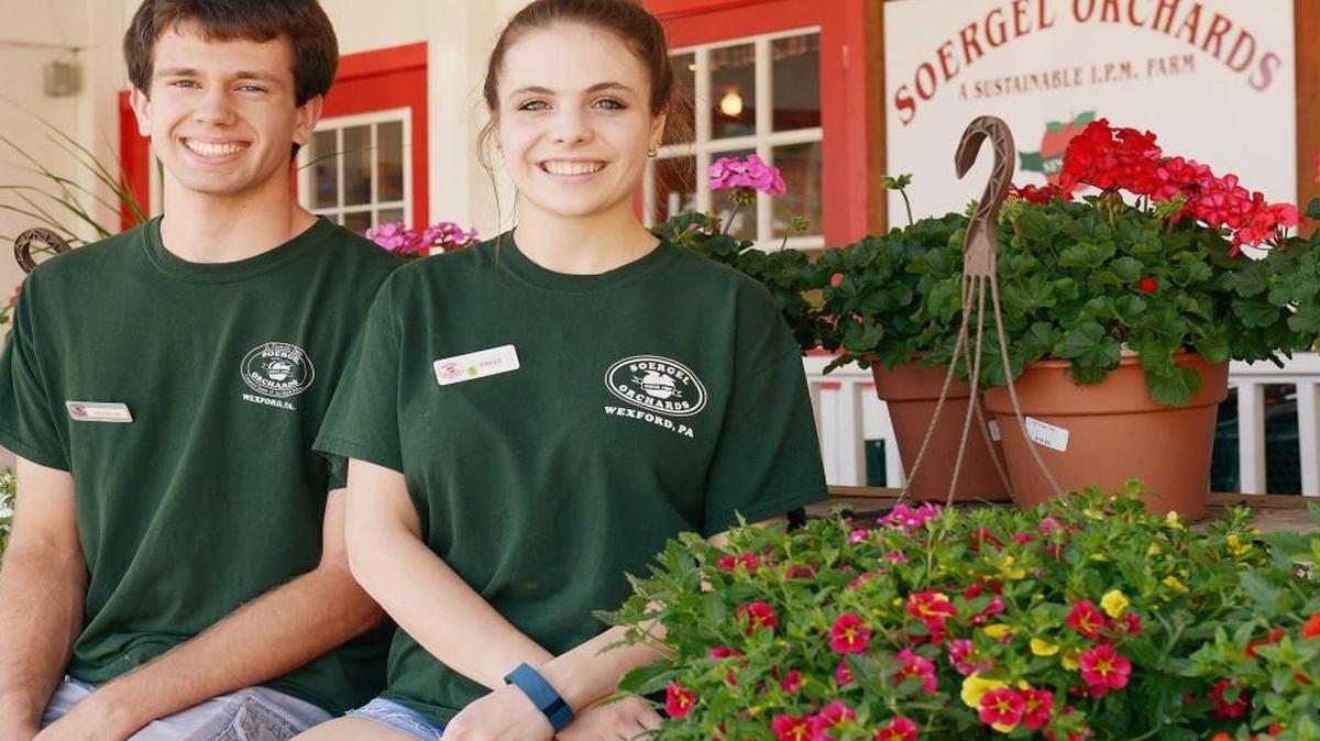 Raymond Buehner, a senior at North Hills High School, and Halle Celebrezze, a senior at North Allegheny, have been working part-time at the market Soergel Orchards in Wexford, Pa., to save up money for college.
