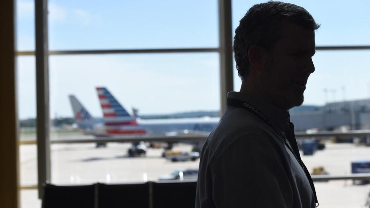 Rev. Nace Lanier is seen as he walks the halls of the Ronald Reagan Washington National Airport in June; Lanier’s airport ministry sustained him through his son’s illness and recent death.