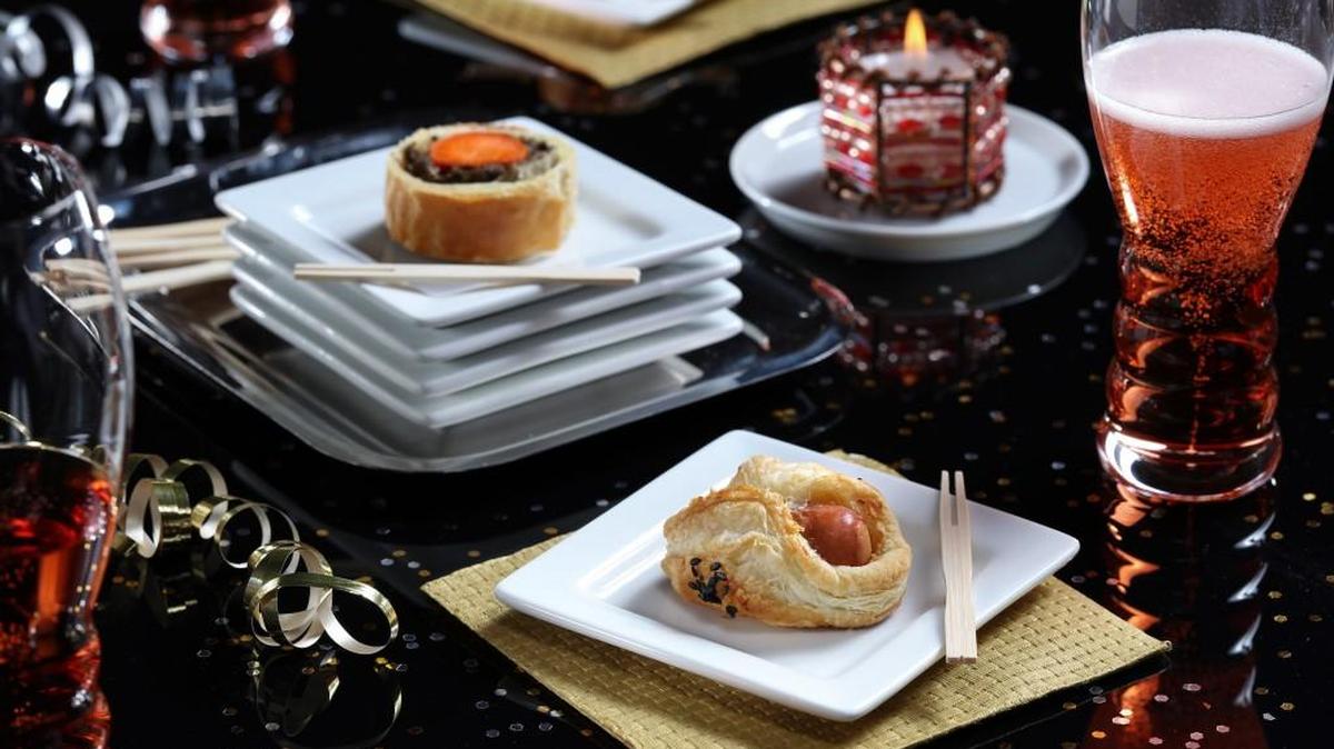 Sausage turnovers (aka pigs in blanket), foreground, are a step up from the usual when wrapped in puffed pastry.