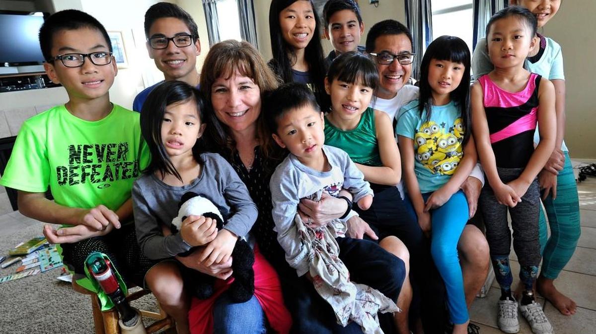 Tamera and Brian Wong with ten of their twelve children; eight were adopted, four biological. The adopted kids have various disabilities. With Tamera and Brian, front row from left: Braxton, 10, Becka Joy, 4, Bennett, 4, Bethany 10, Bella, 7, Bayley, 8, Brooklyn, 12; Back row from left: Bryce, 18, Bythe 17, Brady, 12.