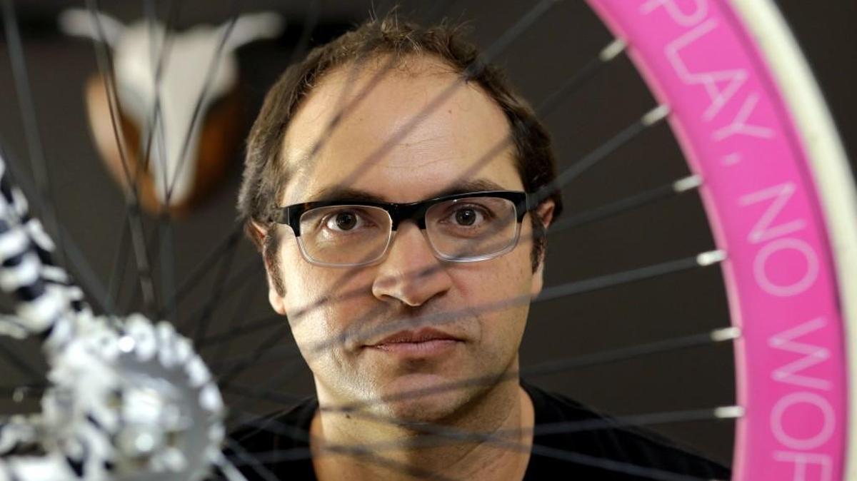 
Avery Pack, president of Republic Bike, with a custom, fixed gear bicycle manufactured at Republic Bike in Dania Beach, Fla. Companies, organizations and people are starting to forsake the familiar “.com” and “.org” Internet address suffixes, using instead hundreds of new ones like “ legal,” “ movie,” “.bike” and “.nyc” that have been coming on the market since early 2014. 
