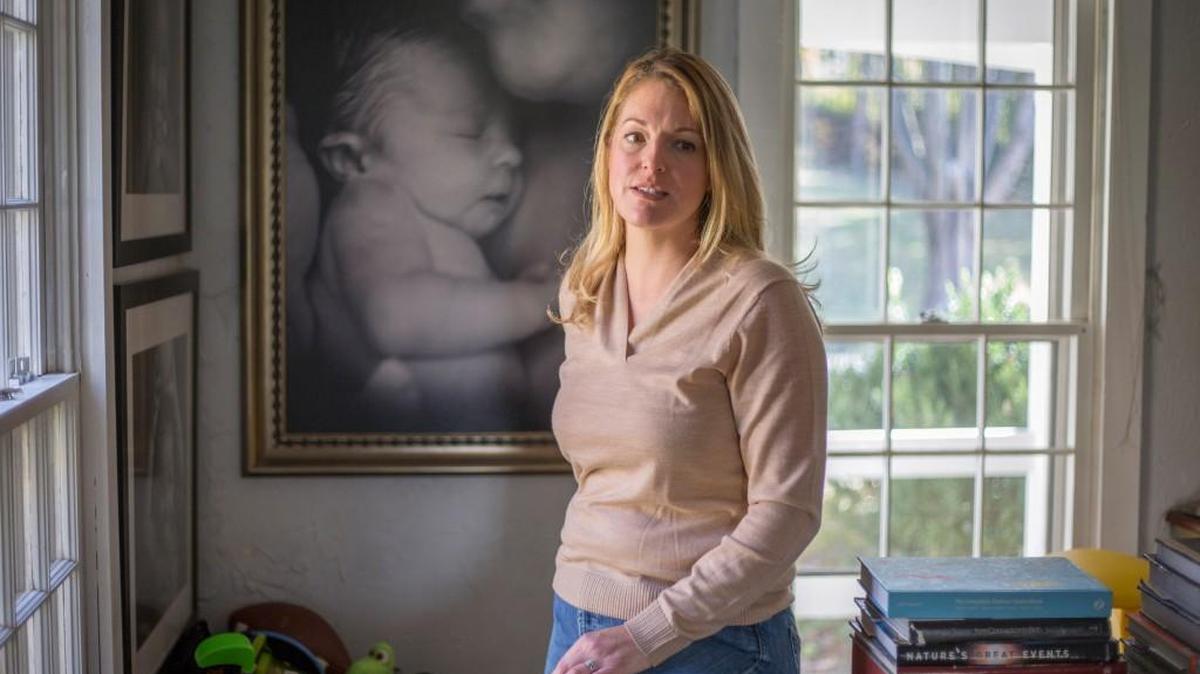 Joyal Mulheron at home with a photo of her infant daughter, Eleanora, who died at nearly five months.