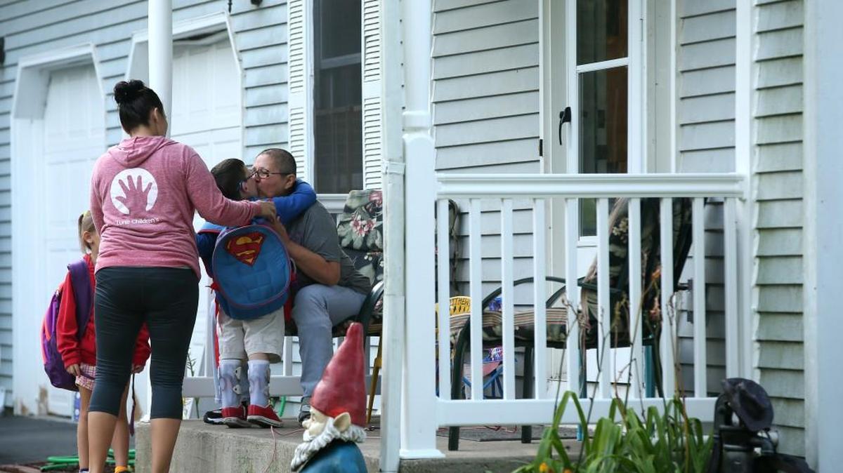 Matthew Erickson hugs his grandmother, Louise Turner, goodbye as he sets off for his first day of kindergarten in Huntley.