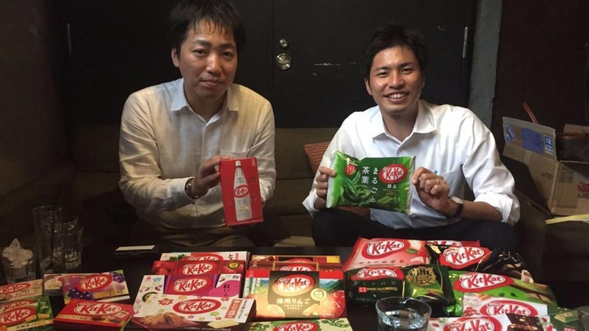 Ryoji Maki, KitKat’s marketing manager in Japan, left, and Nestle Japan spokesman Takuya Hiramatsu show off their wares.