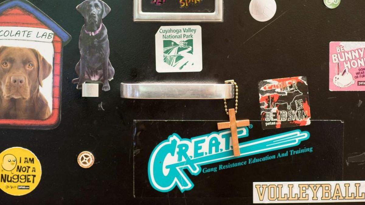 A cross hangs from a filing cabinet in Victoria Tomasheski's classroom at Garfield Heights Middle School in Garfield Heights, Ohio, where she teaches computer classes.