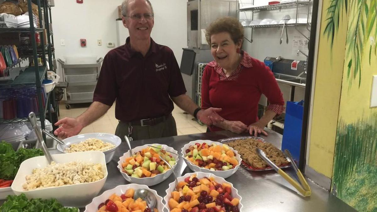 Roy and Wendy Weinberger were among volunteers from Temple Solel who served lunch Christmas Day at the Children’s Attention Home.