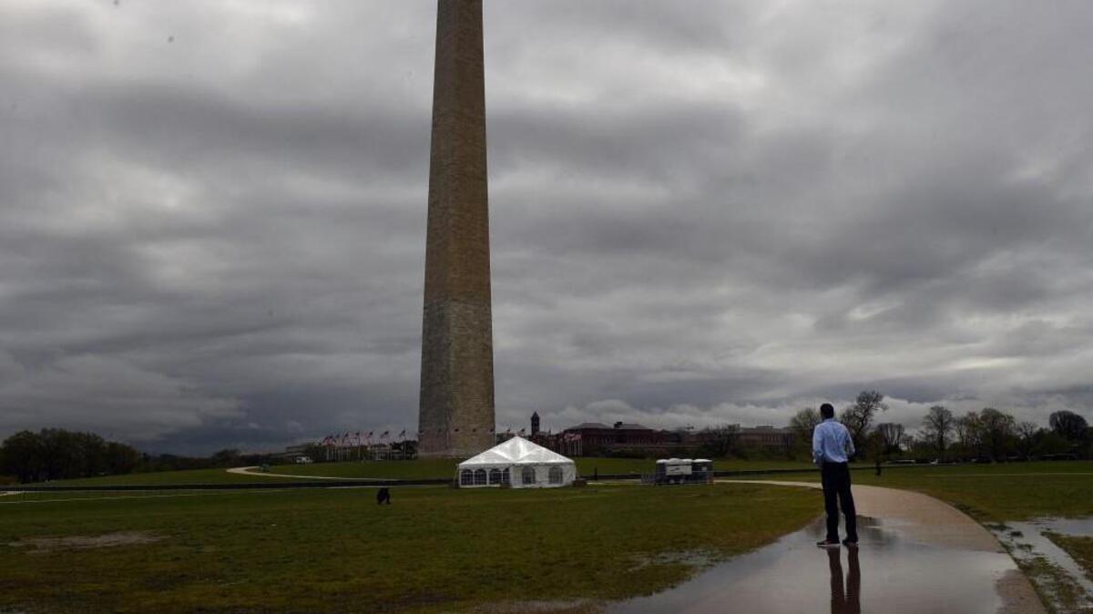 Jason Hershey stands outside of David’s Tent which is located near the Washington Monument in Washington on the National Mall; in seven months, his Christian group has met seekers of every age and faith, looking for a bit of peace or a shoulder to cry on or just a place to rest their feet before resuming their sightseeing.