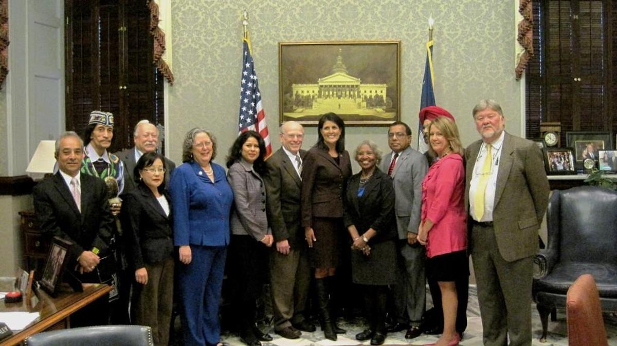 Gov. Nikki Haley, center, stands with members of Interfaith Partners of South Carolina in 2014.