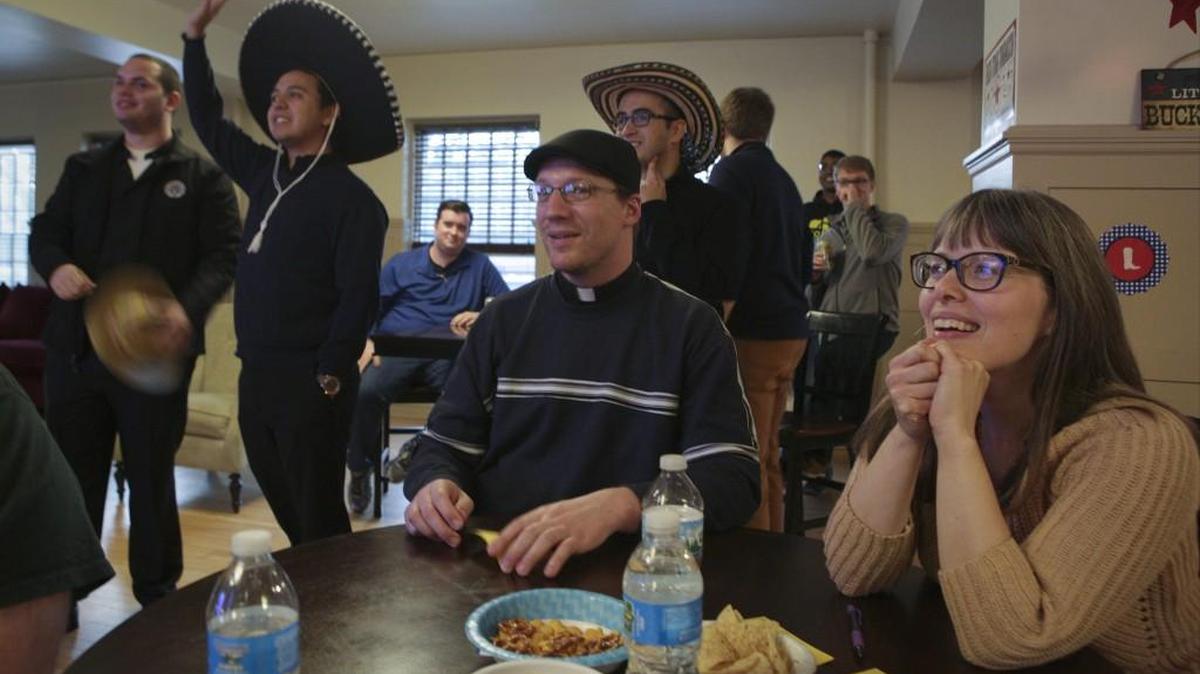 Dawn Eden Goldstein sits with her team during their Wild Wild West Trivia Night at University of St. Mary of the Lake in Mundelein, Ill. Goldstein will be the first woman at the University of St. Mary of the Lake to earn a sacred theology doctorate, a pontifical degree issued under the authority of the Holy See.