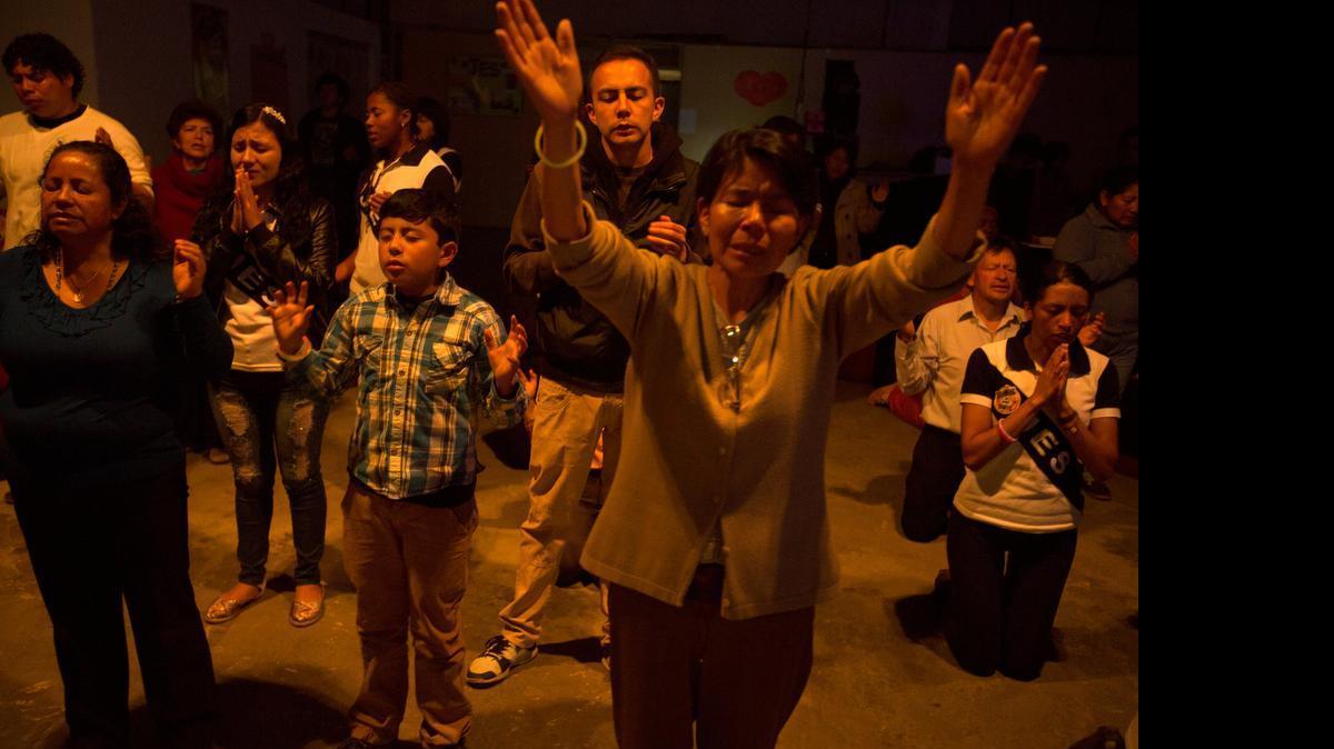 
A Catholic charismatic community worshiping in Quito, Ecuador. Services can include raised arms, rock music and faith healing.
