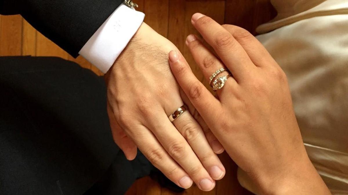 The photo shows the ringed hands of Amber Marlow and her husband, Marley Jay, after their wedding. The couple asked their wedding guests to stay off their phones during the ceremony and other key moments.