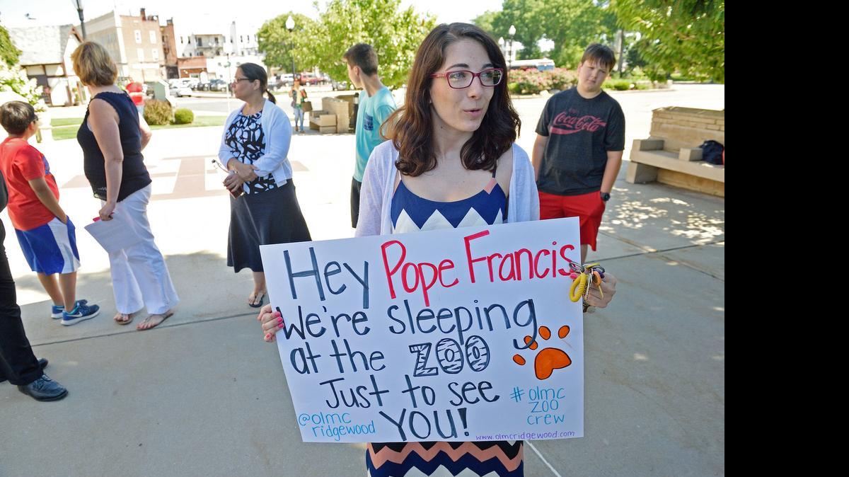 
Melissa Peters with a sign she and others parishioners of Our Lady of Mount Carmel Church in Ridgewood, N.J., plan to display in Philadelphia during Pope Francis’ visit. 
