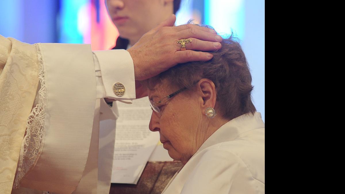 
Sheila Ryan celebrates the first Rite of Consecration of Virgins Living in the World in the Diocese of Pittsburgh, the first since the Catholic Church restored that liturgical rite in 1970. 
