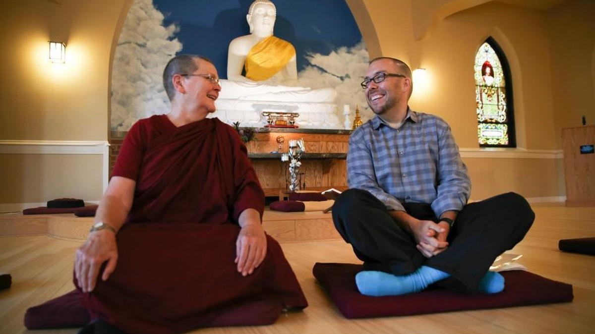 
Vimala Bhikkhuni, left, and Tyler Lewke in the Blue Lotus Buddhist Temple in Woodstock, Ill. Buddhist groups can offer lessons in meditation and other teachings to help lead people to sobriety. 
