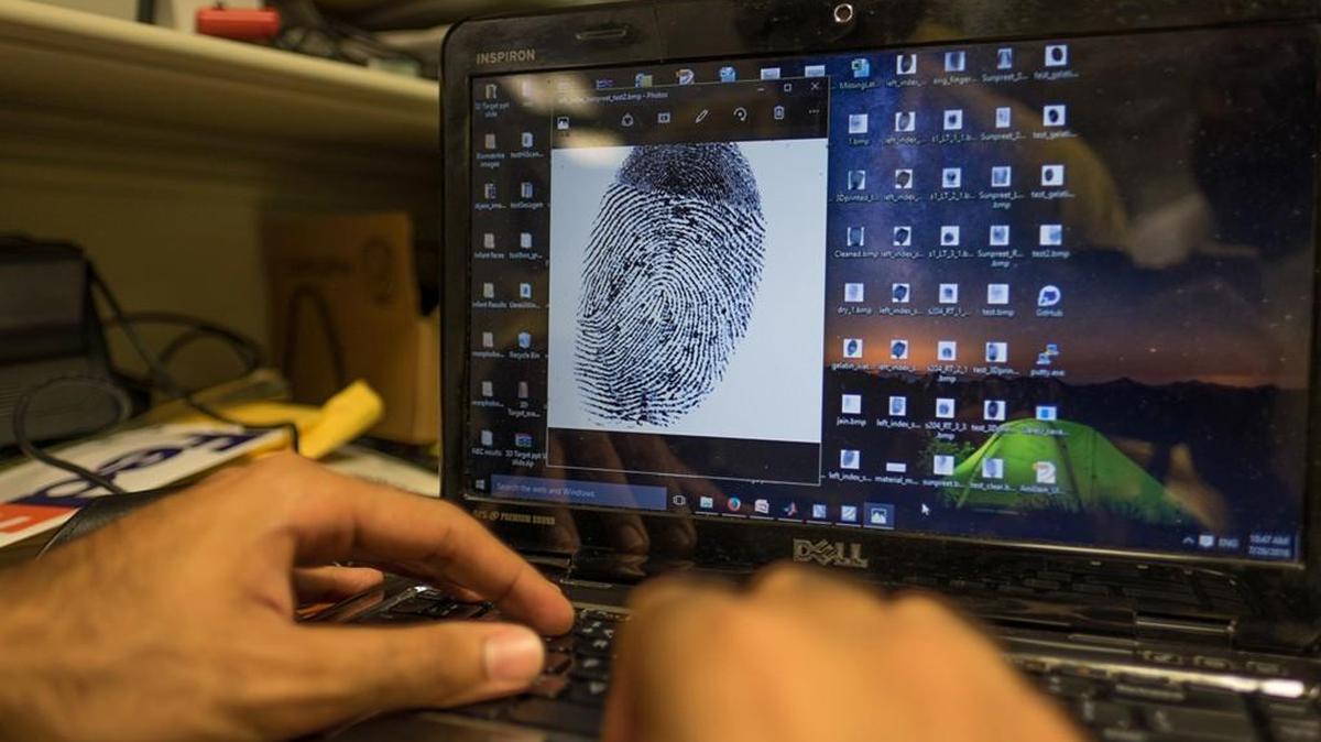 Doctoral student Sunpreet Arora analyzes a fingerprint while working on a project to unlock a homicide victim’s smartphone.