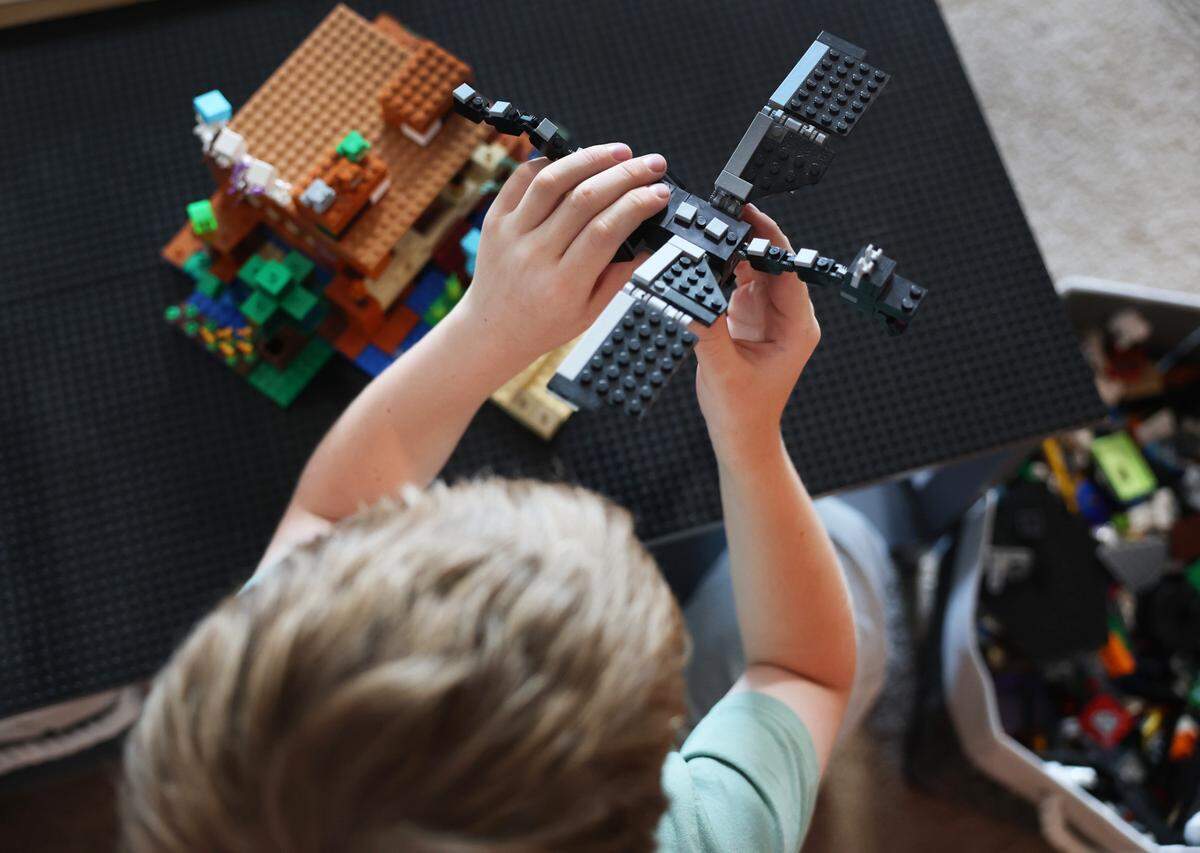 A Fort Mill boy plays with Lego bricks Thursday. The boy, whose parents asked that he not be identified, attends the Lego Club at the York County Library in Fort Mill.
