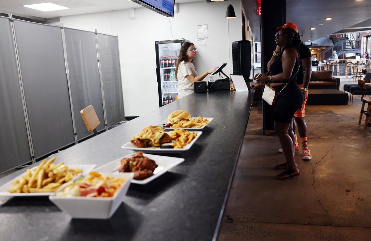 Madison Mellow takes orders from Jackie Ashley and Maco Keitt Friday at The Power House in Rock Hill’s Knowledge Park.