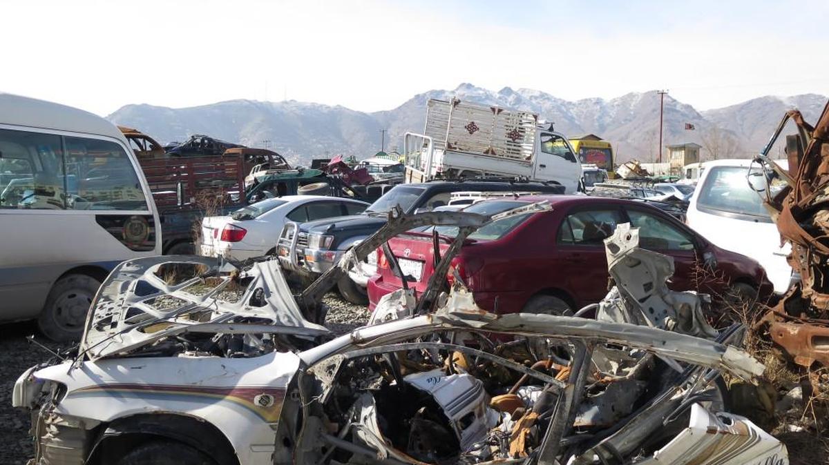 A vehicle, destroyed when its driver detonated his suicide vest near the Kabul airport on Jan. 4, now sits in Shahrak police station on the outskirts of Kabul, 2016. Hours after the explosion, another bomb went off in almost exactly the same location.