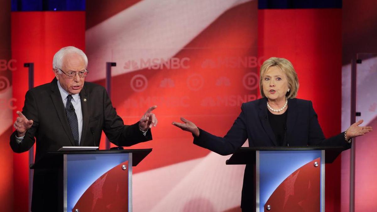 Democratic presidential candidates Bernie Sanders and Hillary Clinton spar during a Democratic presidential primary debate at the University of New Hampshire on Thursday.
