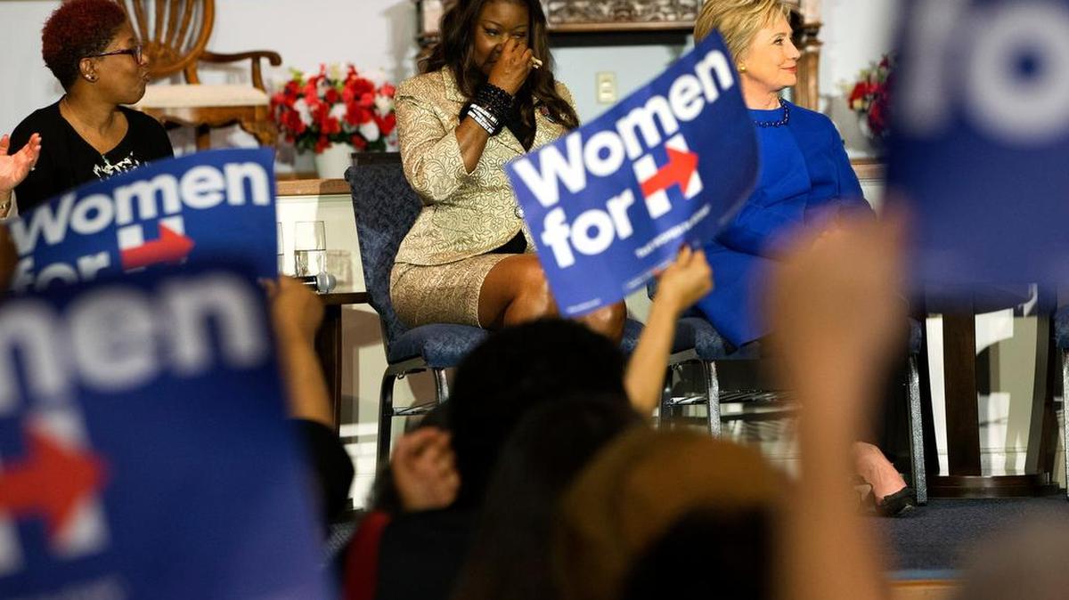 Sybrina Fulton, mother of Trayvon Martin, wipes her eyes during a campaign event with Democratic presidential candidate Hillary Clinton during a rally at the Central Baptist Church in Columbia on Tuesday with mothers of victims of gun violence. At left is Maria Hamilton, mother of Dontre Hamilton.