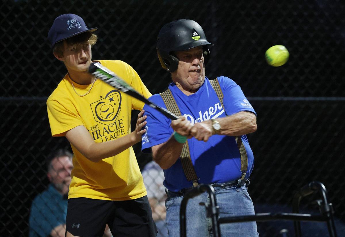 Larry Ferguson, a player on the Miracle League of Rock Hill’s Dodgers, prepares to hit the ball Wednesday at a game. Ferguson recently turned 80.