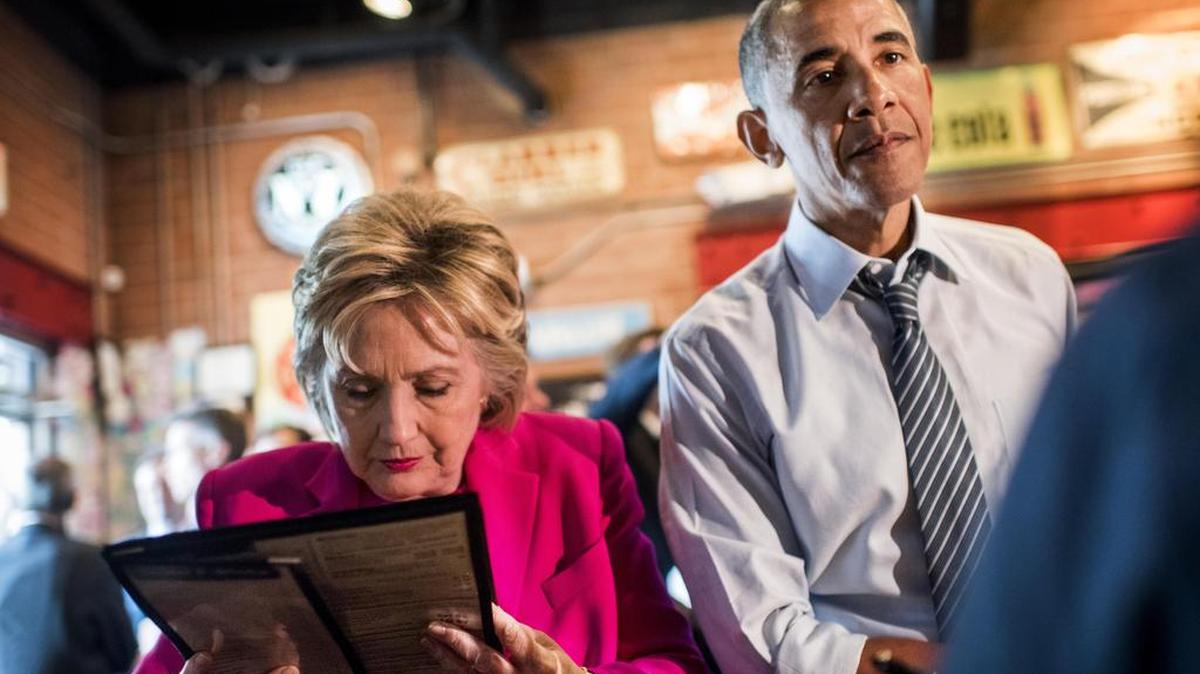 Democratic presumptive nominee Hillary Clinton and President Barack Obama prepare to order some barbecue at Midwood Smokehouse after a rally in Charlotte on Tuesday.