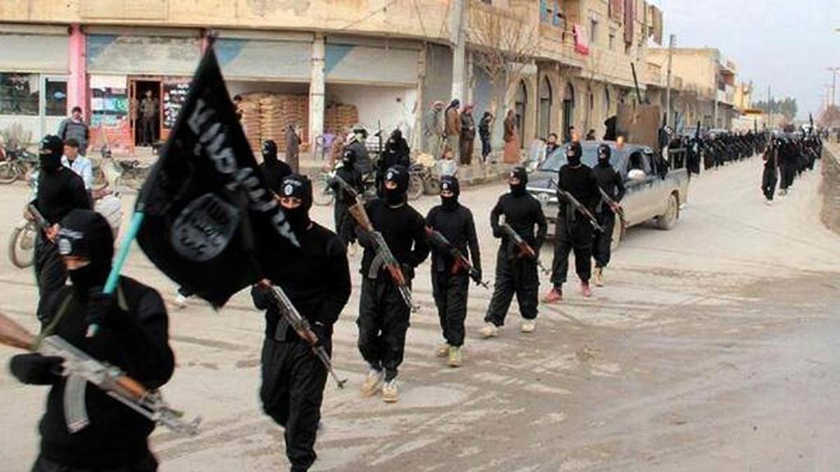 Fighters from the al-Qaida linked Islamic State of Iraq and the Levant (ISIL) marching Jan. 14, 2014, in Raqqa, Syria.