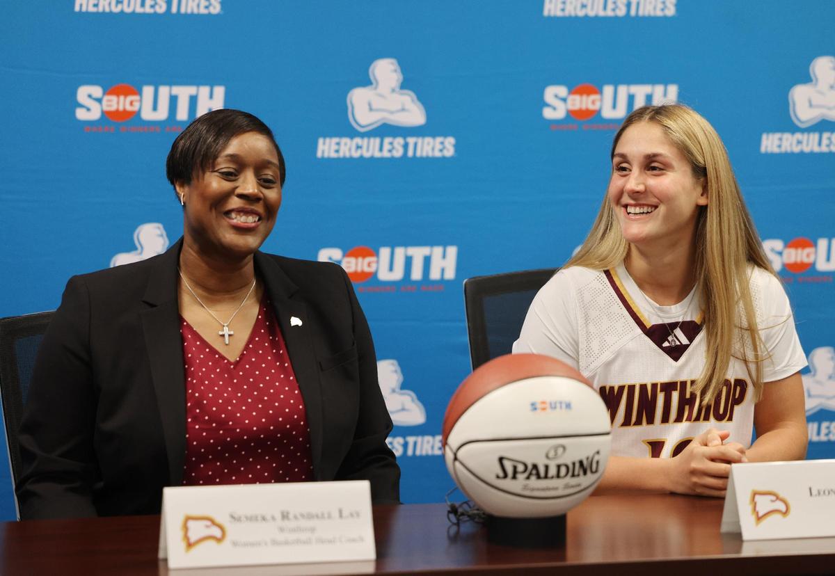 Winthrop women’s basketball coach Semeka Randall Lay, left, and player Leonor Paisana talk about the upcoming season Tuesday in Charlotte.