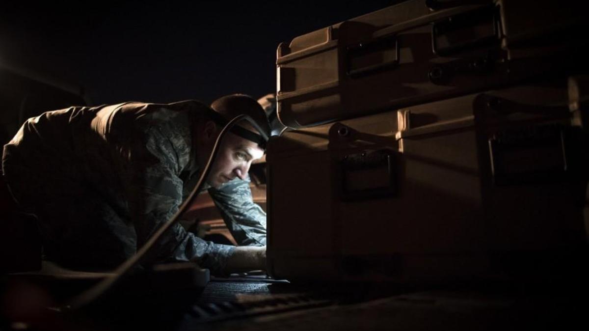 Capt. Brian Goodman, 527th Space Aggressor Squadron, ensures equipment is ready before a mission to disrupt a unit’s space capabilities during exercise Red Flag at Nellis Air Force Base, Nev. Red Flag is aimed at teaching service members how to integrate air, space and cyberspace elements.