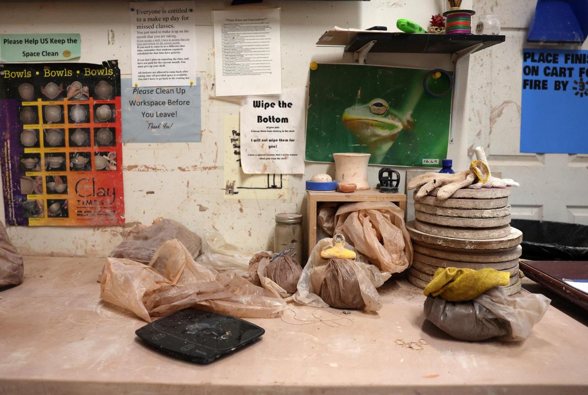 A pottery workspace shows bags of clay and notices to working artists at the Tom S. Gettys Center in downtown Rock Hill.