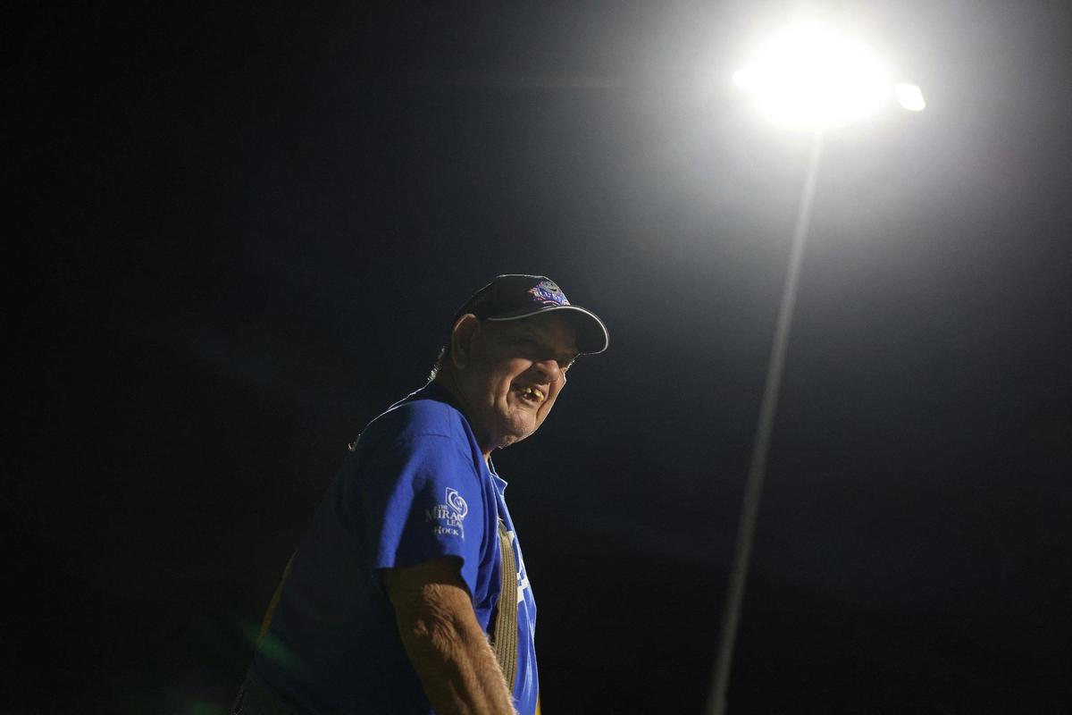 Larry Ferguson, player on the Miracle League’s Dodgers team in Rock Hill, stands under the stadium lights Wednesday in Rock Hill.
