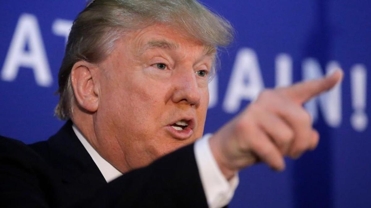 Donald Trump told a community college crowd in Iowa on Thursday that he suspects some Syrian refugees are “soldiers” who could cause harm to the United States.