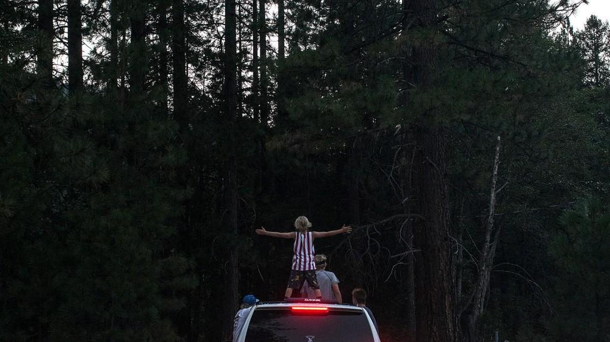 
Landon Watson feels the freedom of summer as he joins his brothers on a trip to Grizzly Hideout campground on July 28 in Taylorsville, Calif. A beautiful spot on the river was recently purchased by his father, Robert, who vacationed there as a child. 
