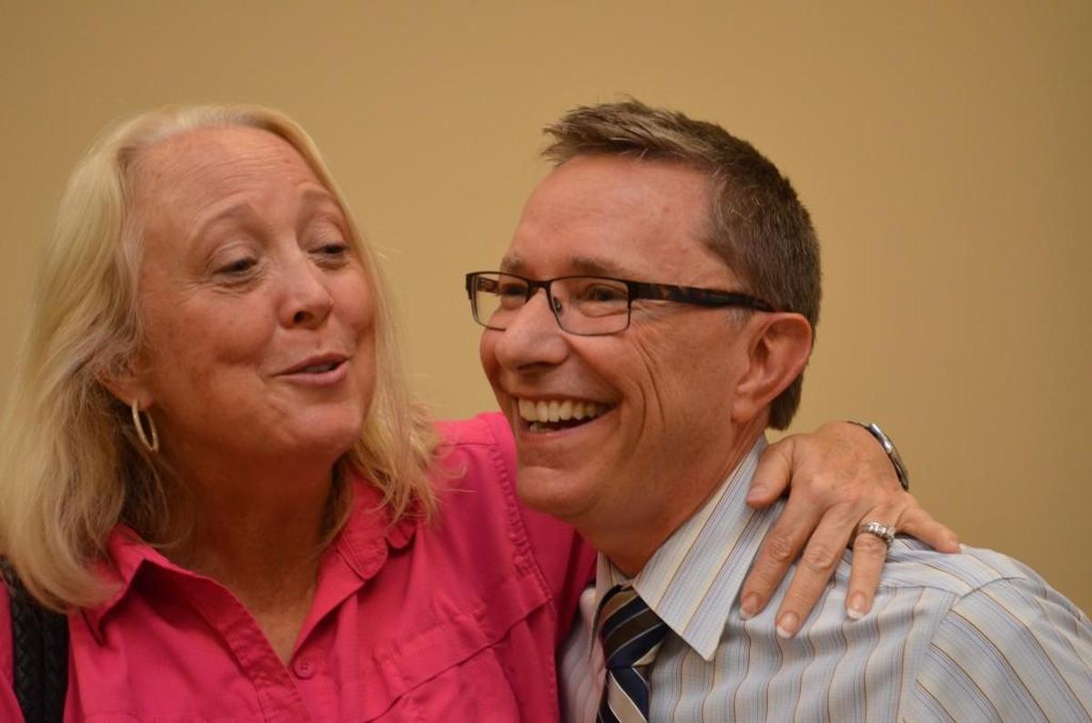  Kathy Wilson, left, shared a moment with Tony Fountain during his goodbye party at Westminster Towers. She succeeds Fountain as board chairman at Hospice & Community Care of Rock Hill.
