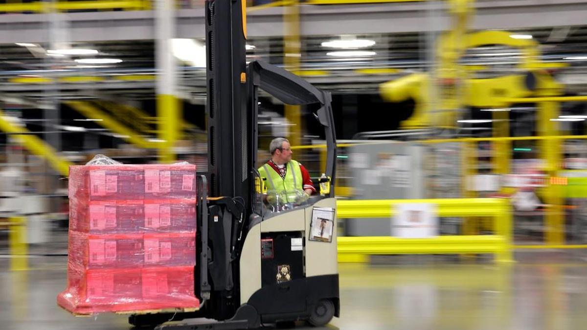 A forklift operator moves a pallet of goods at an Amazon.com fulfillment center in DuPont, Wash. This year, Amazon has been making an aggressive push to offer same-day delivery to its $99 annual Prime loyalty club members. Their service is now available in 750 cities and towns in 16 metro areas. And where Amazon goes, other retailers must follow.