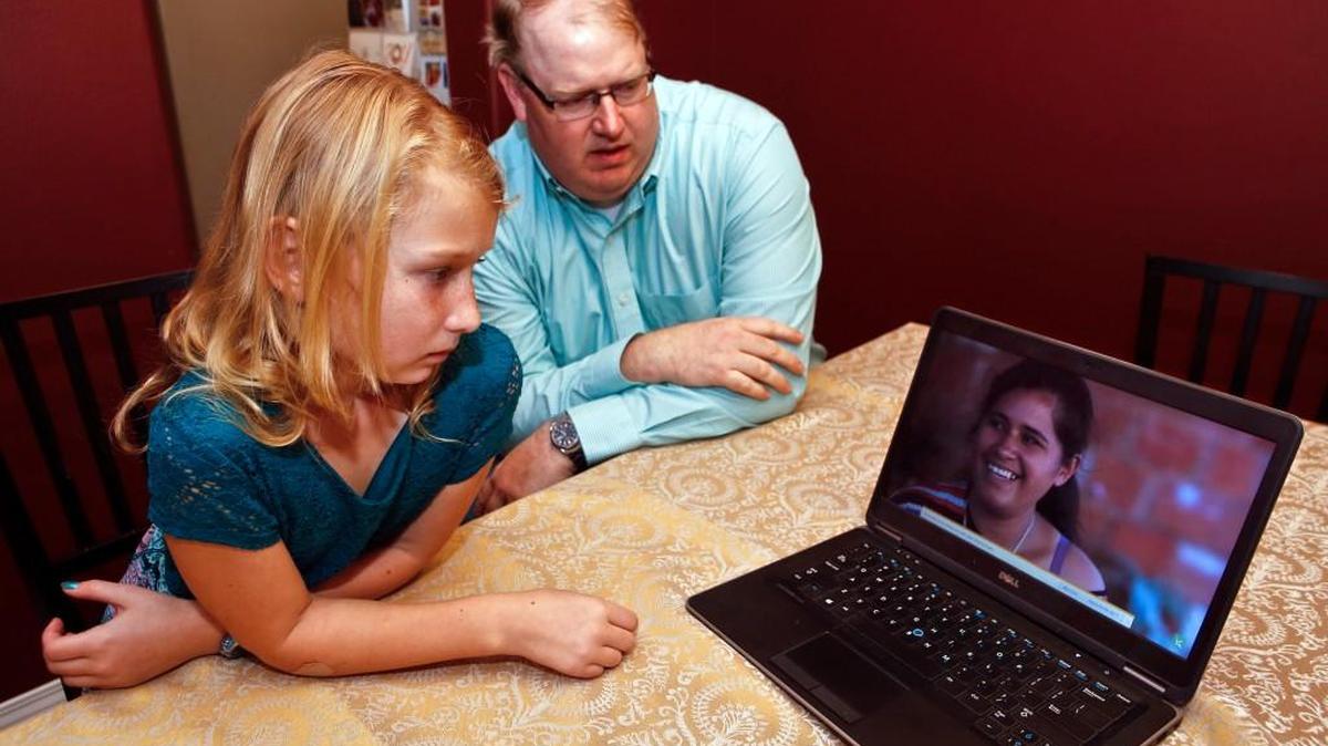 Amara Kirkpatrick, 9, uses Kiva.org to read profiles of women needing small loans in other countries. With the help of her dad, David, Amara has made 45 loans totaling $1,125 to women in 18 countries.