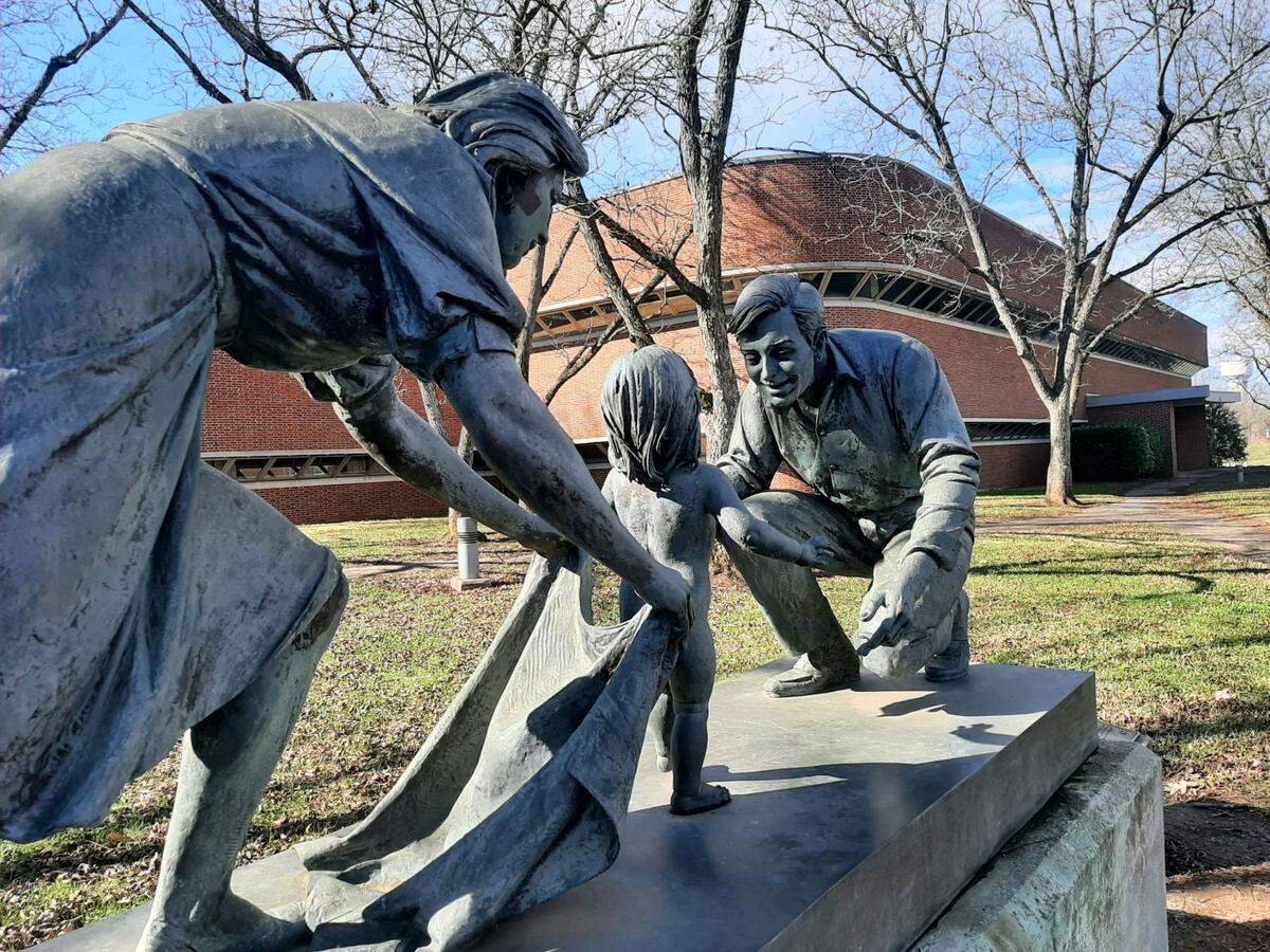 In this Herald file photo, a statue stands in front of the former Springs Global headquarters at 205 N. White St. in Fort Mill. The town will now use the former headquarters building for town hall functions.