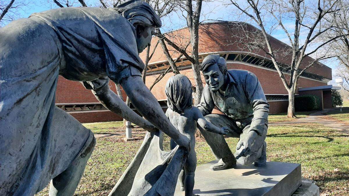 In this Herald file photo, a statue stands in front of the former Springs Global headquarters at 205 N. White St. in Fort Mill. The town will now use the former headquarters building for town hall functions.