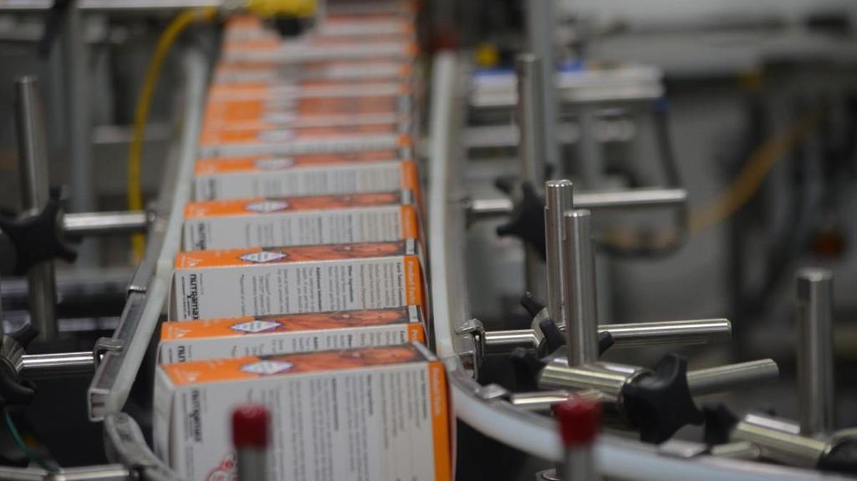 Boxes of the Cosequin veterinary supplement for dogs rolls down the packaging line in this file photo at the Nutramax Laboratories in Lancaster. The company announced it’s expanding, bringing 225 new jobs and a $20 million investment.