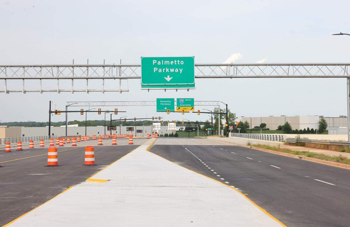 Traffic cones direct drivers to keep drivers in one lane on Palmetto Parkway. The Exit 81 interchange off Interstate 77 would’ve served the Carolina Panthers headquarters, but now opens with no plans announced for the 245-acre site.
