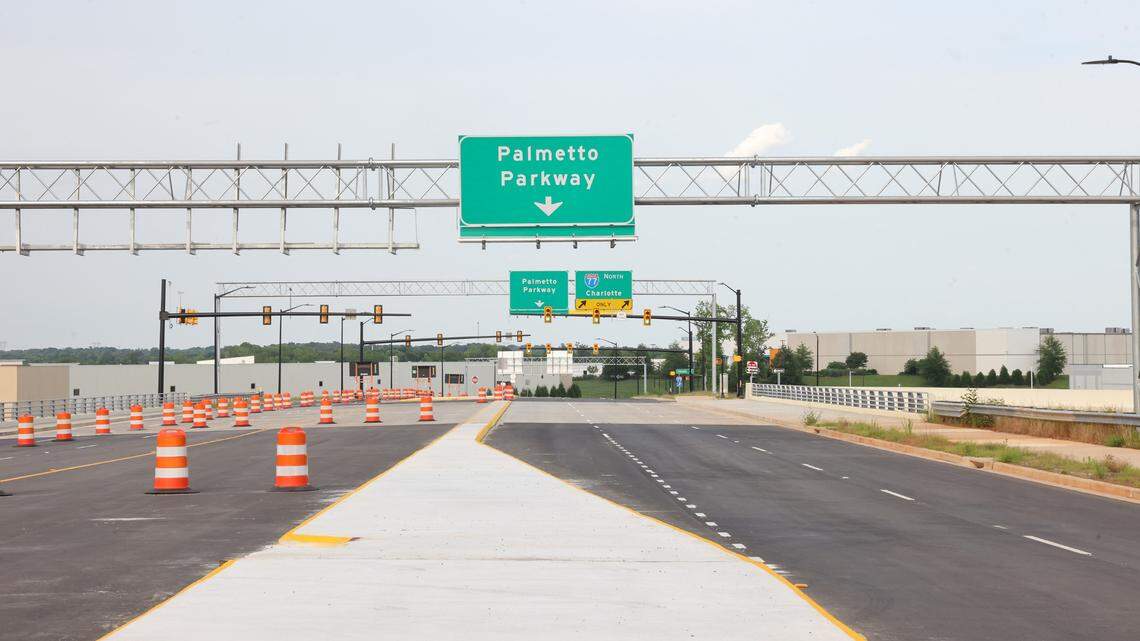 Traffic cones direct drivers to keep drivers in one lane on Palmetto Parkway. The Exit 81 interchange off Interstate 77 would’ve served the Carolina Panthers headquarters, but now opens with no plans announced for the 245-acre site.