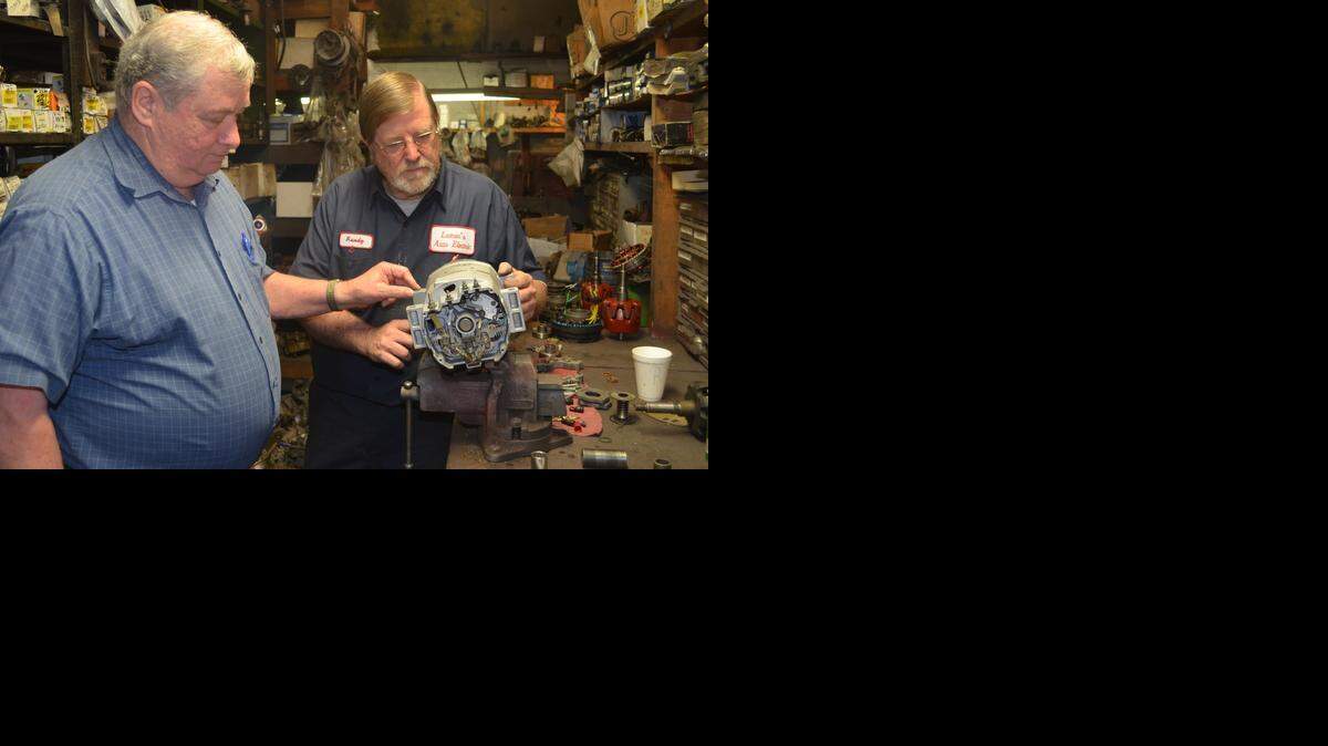 
Lamar Cochrell and Randy Brooks check out an alternator at Cochrell’s shop on Latham Court in Rock Hill. 
