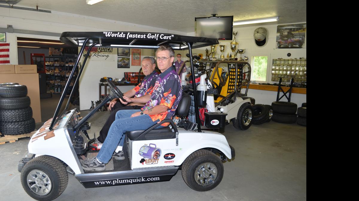 
Robby Steen and his dad, Carson, in “Bandit,” currently the world’s fastest golf cart at 118.76 miles per hour. 

