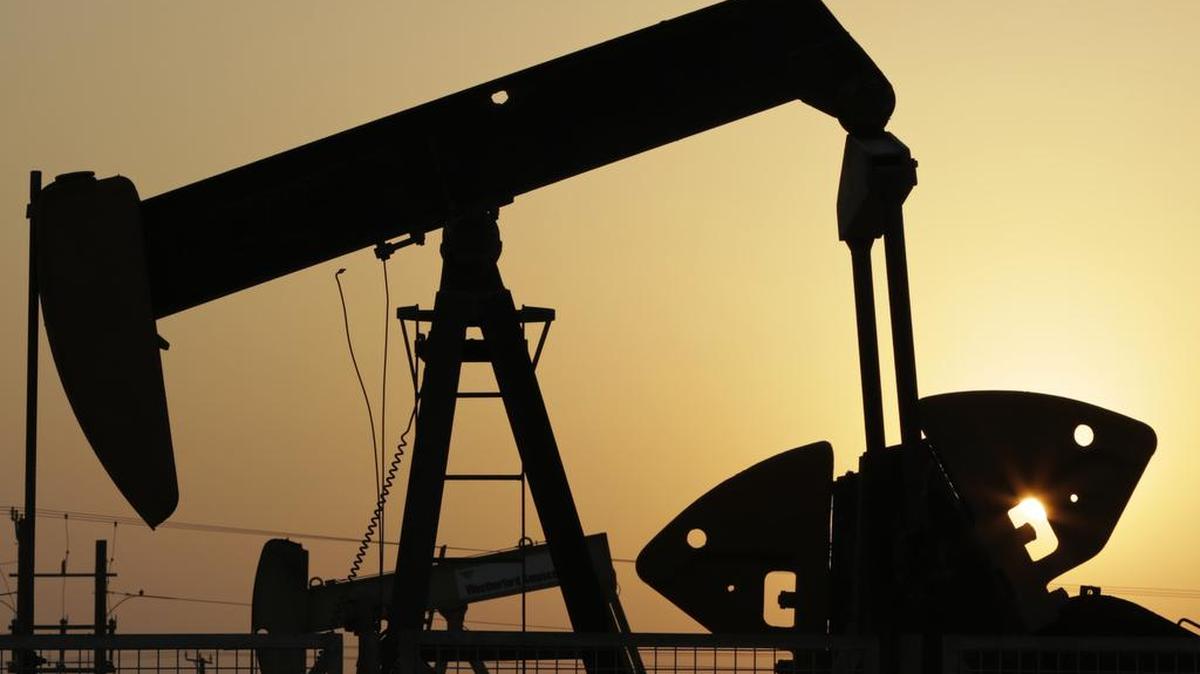 Oil pumps work in the desert oil fields of Sakhir, Bahrain. Russia’s energy minister, Alexander Novak, said, last week that it has agreed with Saudi Arabia, Qatar and Venezuela to freeze oil production at January 2016 levels if other producers do the same following a closed-door meeting in the Doha, Qatar. The meeting reflects growing concern among major oil producers about the effects a prolonged slump in crude prices will have on their domestic economies.
