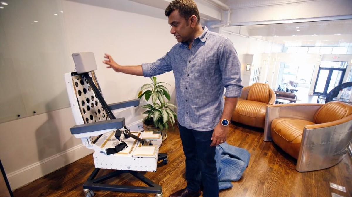 Agie Sundaram, co-owner of Span Enterprises, shows the company's new office in downtown Rock Hill. He plans to make his desk chair from a pilot's aircraft seat.