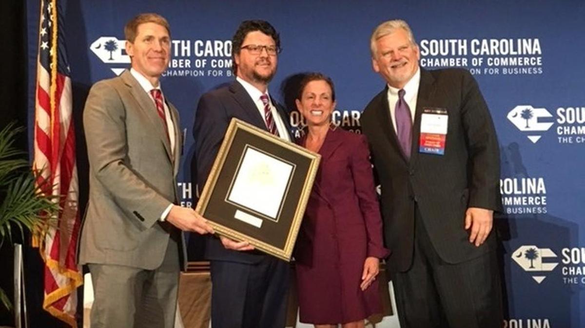 State Rep. Gary Simrill, R-Rock Hill, poses for a photo with members of the South Carolina Chamber of Commerce after receiving the 2017 Public Servant of the Year award from the organization.