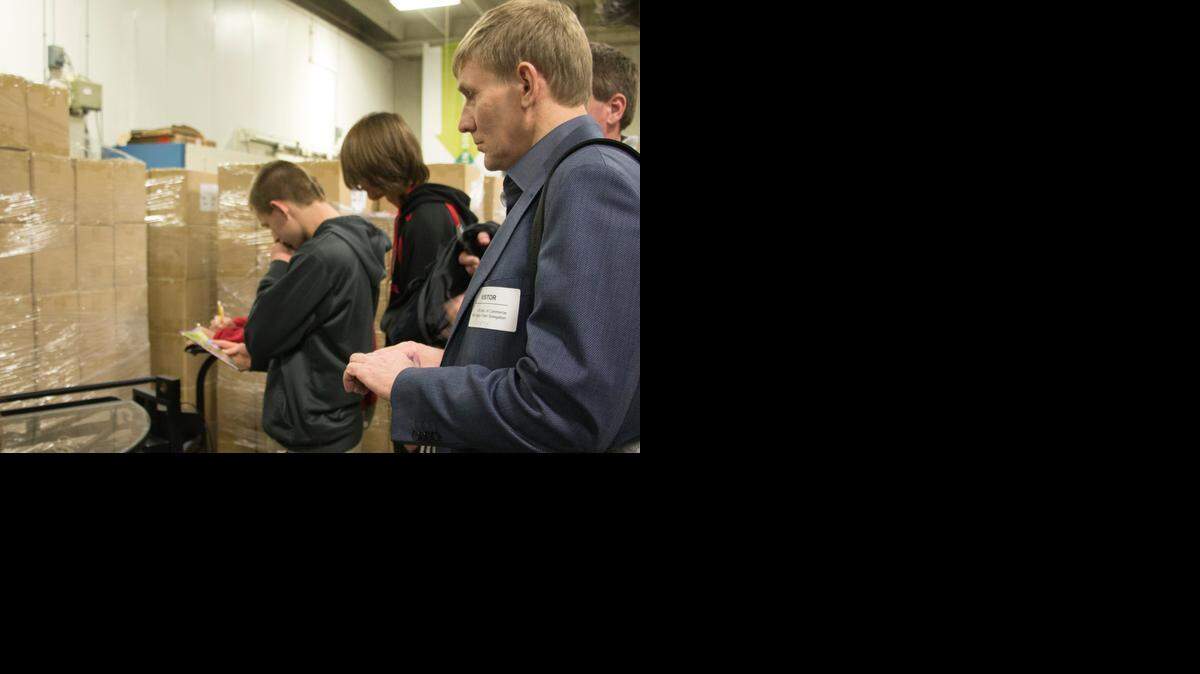 
Sergey Kozhevnikov, director of the Siberian Logistics Company in Krasnoyarsk, Russia observes Rock Hill students practicing skills learned in the Material Handling and Logistics program at the District’s Applied Technology Center. Twenty-three upper management officials from international companies and two U.S. Department of Commerce administrators visited the school last week to learn strategies for early awareness of employment opportunities, as well as a work-ready workforce for businesses in the supply chain industry. 
