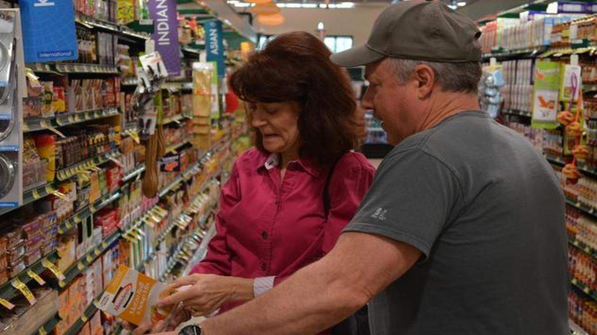 
Steve and Marsha Yaffe, who live in Regent Park, check out the labels at the newly opened Fort Mill Harris Teeter on Wednesday morning. 
