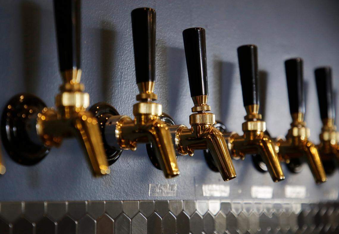 Beer spouts showcase the type of brew served at Working Theory Beer Company in York.