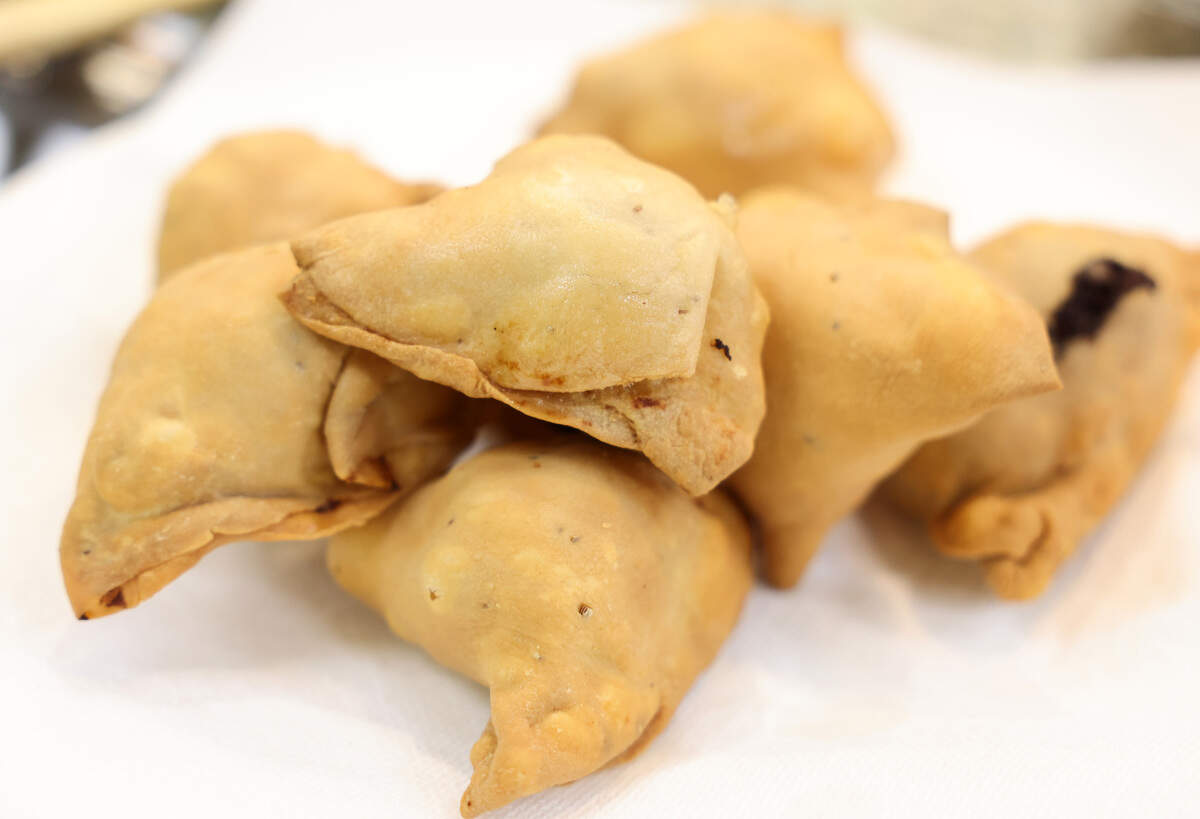 Students at Santhoshi’s Kitchen make samosa, shown here, which are deep fried pastries with potatoes and onions.